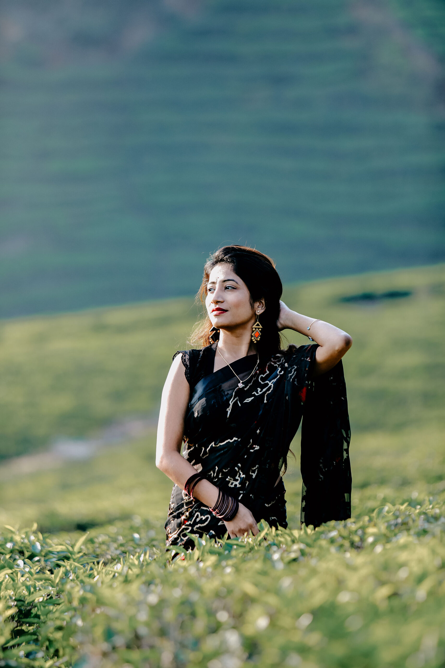 "Candid vacation photoshoot in Munnar tea gardens during a hill station getaway"
