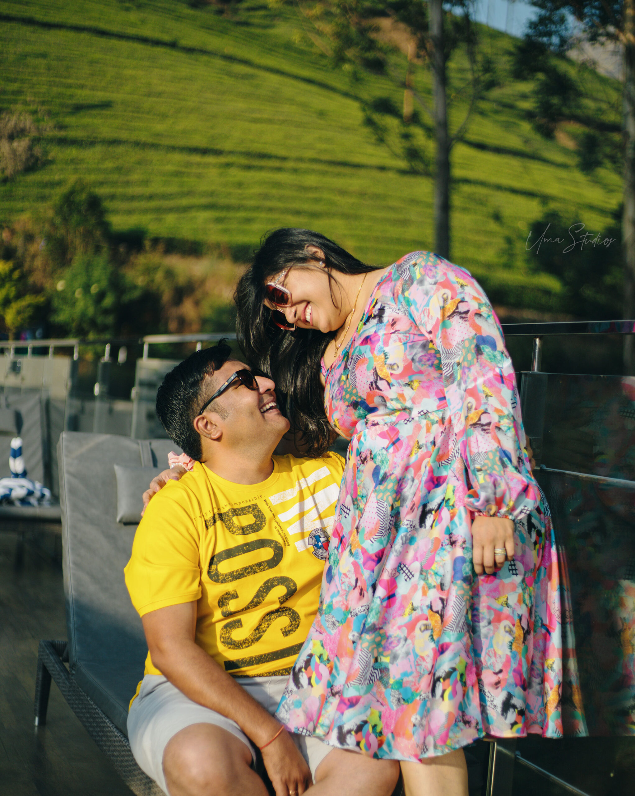 "Casual couple shoot in Munnar hills with fog and greenery in the background"